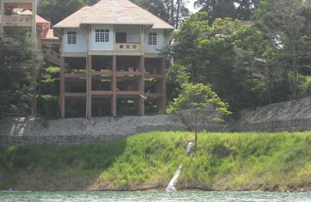 Repaired grassed slope below a building on the shore of Tasik Kenyir